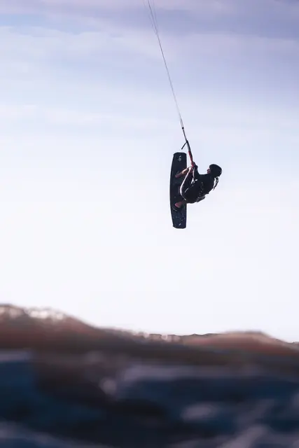 Kitesurf rider in action, photo by Olivier Schmitt