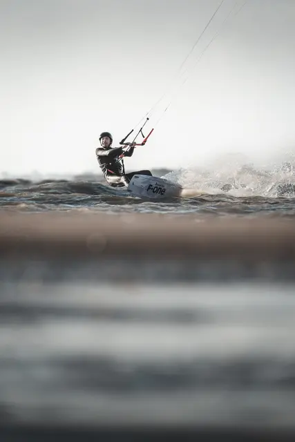 Kitesurf rider in action, photo by Olivier Schmitt
