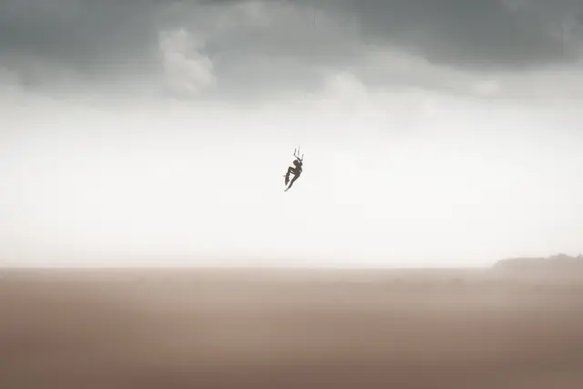 Kitesurf rider in action, photo by Olivier Schmitt